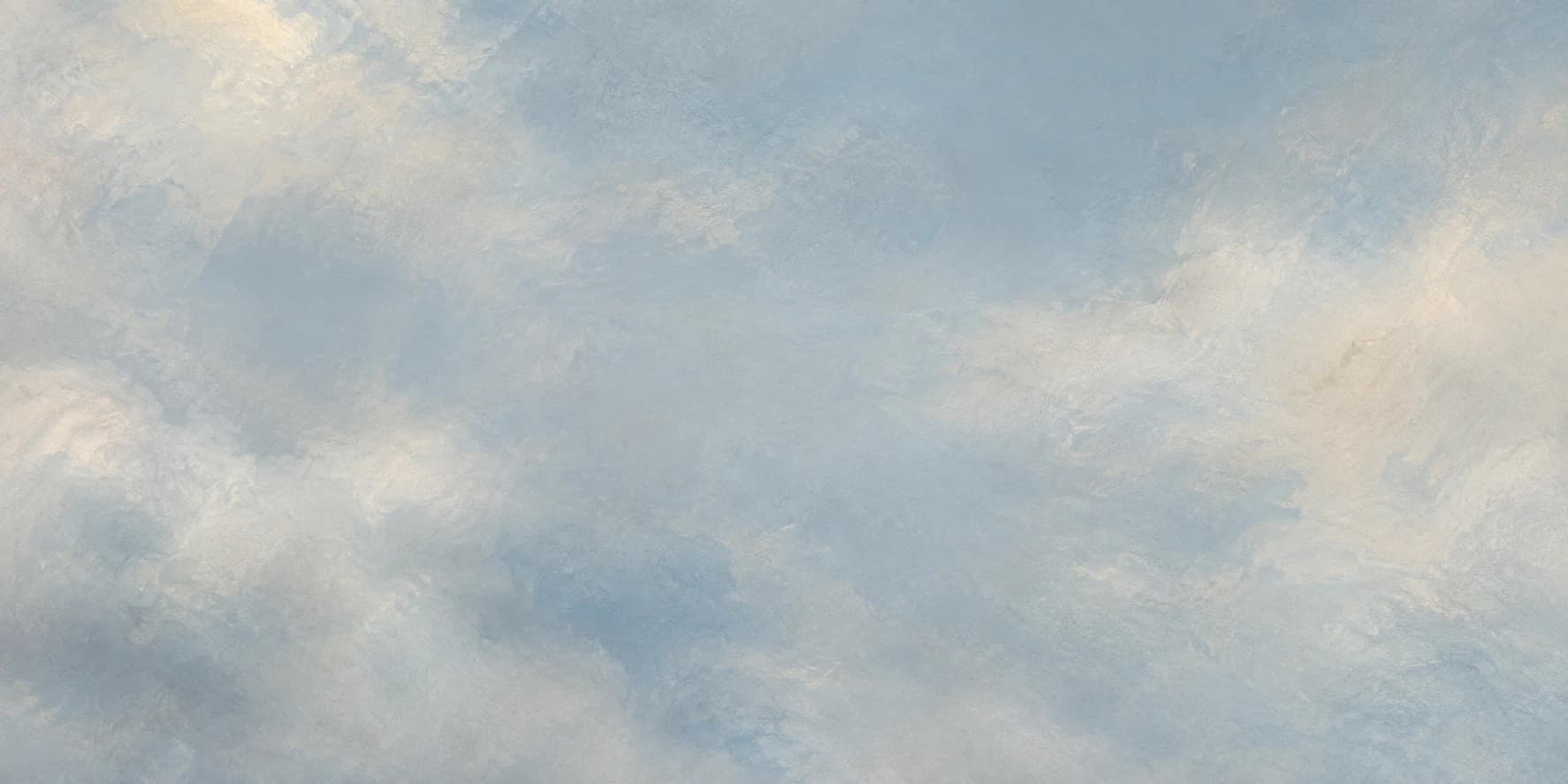 Painted blue sky with pale drifting clouds